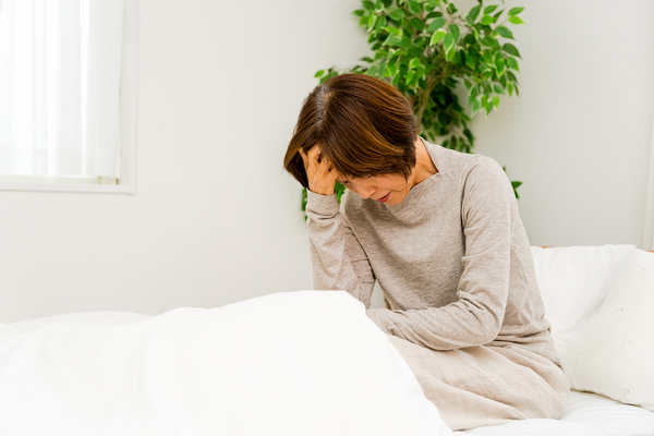 体調不良の女性